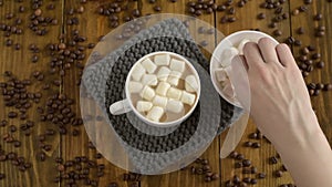 Putting marsh mallows into coffee