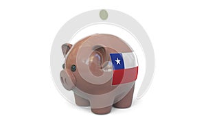 Putting money into piggy bank with flag of Chile. Tax system system or savings related conceptual 3D rendering