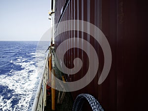 putting razor wire on boar a big ship before entering in guinea gulf