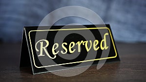 Putting reserved sign on a restaurant table