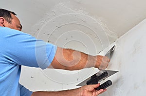 Putting spackle on a wall