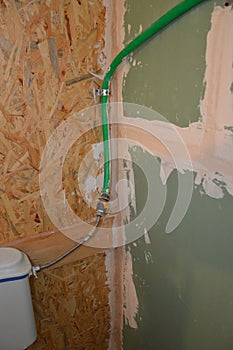 Puttying walls and cracks with a solution of finishing putty