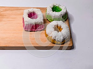 Putu Ayu cake on a wooden pedestal