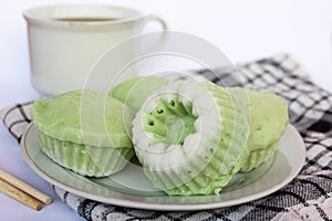 Putu ayu pandan cake, a traditional Indonesian cake made from rice flour and topped with grated coconut.