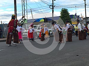 Puyo, Ecuador, 4-11-2019: a dancing group of indigenous people from the sierra showing their traditional dance
