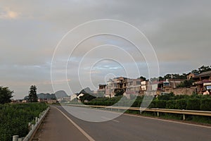 Puzehei Scenic Area at dusk with a serene lake reflecting the countless lotus flowers