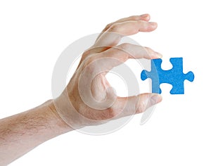 Puzzle in hand on white background