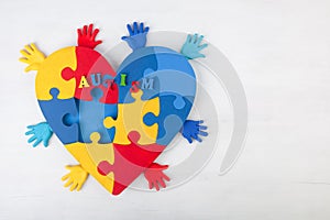 Puzzle heart hands support autism awareness