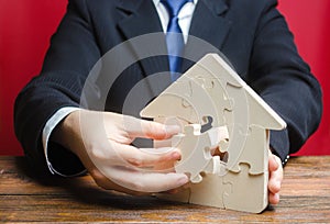 Puzzle house with a missing piece. Purchase or construction comfortable dream home. Mortgage loan purchase real estate.