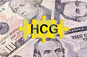 Puzzle with the image of dollars in the center of the inscription -HCG