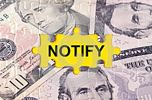 Puzzle with the image of dollars in the center of the inscription -NOTIFY