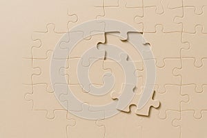 A puzzle with a missing piece. Space for text.