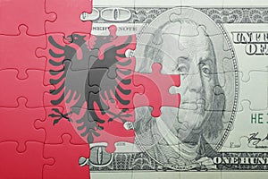 Puzzle with the national flag of albania and dollar banknote