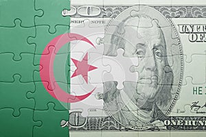Puzzle with the national flag of algeria and dollar banknote