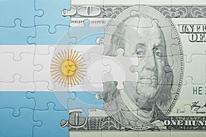 Puzzle with the national flag of argentina and dollar banknote