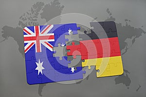 Puzzle with the national flag of australia and germany on a world map background.