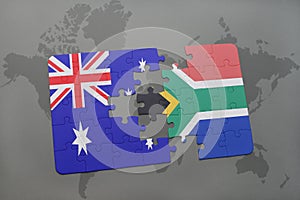 puzzle with the national flag of australia and south africa on a world map background.