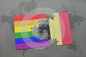 puzzle with the national flag of belgium and gay rainbow flag on a world map background.