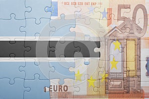 Puzzle with the national flag of botswana and euro banknote