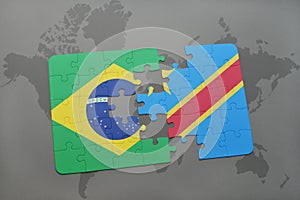puzzle with the national flag of brazil and democratic republic of the congo on a world map background. photo