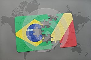 puzzle with the national flag of brazil and republic of the congo on a world map background. photo