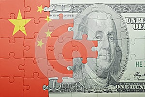 Puzzle with the national flag of china and dollar banknote