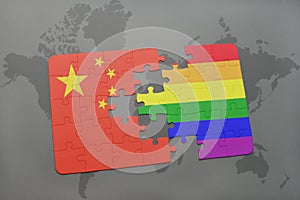 puzzle with the national flag of china and gay rainbow flag on a world map background.