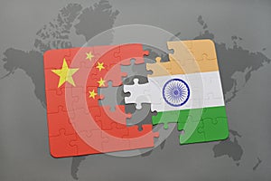puzzle with the national flag of china and india on a world map background.