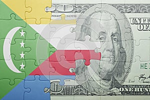 Puzzle with the national flag of comoros and dollar banknote