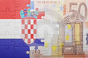Puzzle with the national flag of croatia and euro banknote