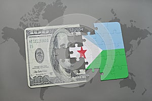 puzzle with the national flag of djibouti and dollar banknote on a world map background.