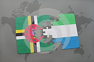 puzzle with the national flag of dominica and sierra leone on a world map