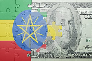 Puzzle with the national flag of ethiopia and dollar banknote