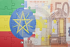 Puzzle with the national flag of ethiopia and euro banknote