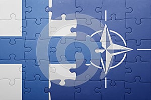 Puzzle with the national flag of finland and nato