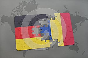 puzzle with the national flag of germany and romania on a world map background.