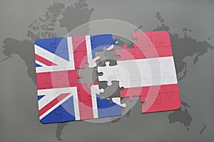 puzzle with the national flag of great britain and austria on a world map background