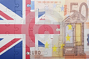 Puzzle with the national flag of great britain and euro banknote