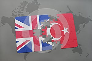 puzzle with the national flag of great britain and turkey on a world map background