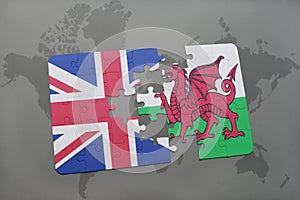 Puzzle with the national flag of great britain and wales on a world map background