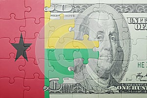 Puzzle with the national flag of guinea bissau and dollar banknote