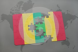 puzzle with the national flag of guinea and mali on a world map