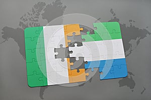 puzzle with the national flag of ireland and sierra leone on a world map