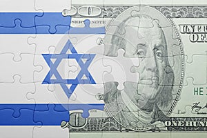 Puzzle with the national flag of israel and dollar banknote