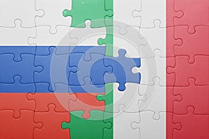 Puzzle with the national flag of italy and russia