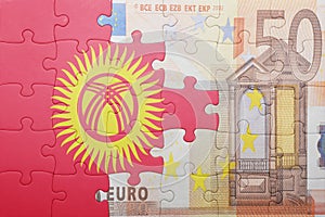 Puzzle with the national flag of kyrgyzstan and euro banknote