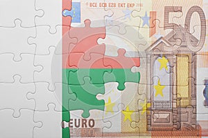 Puzzle with the national flag of madagascar and euro banknote