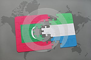 puzzle with the national flag of maldives and sierra leone on a world map