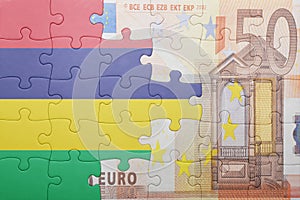 Puzzle with the national flag of mauritius and euro banknote