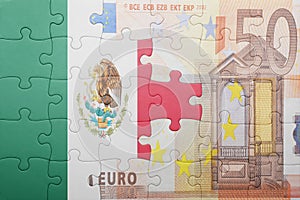 Puzzle with the national flag of mexico and euro banknote